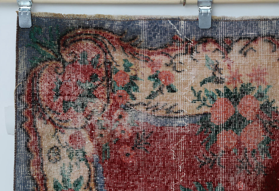 Vintage red beige oriental rug displayed in traditional living room