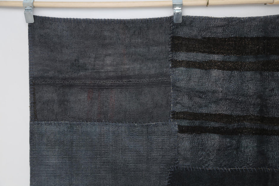Close-up of tonal variation detail on dark blue hemp patchwork rug