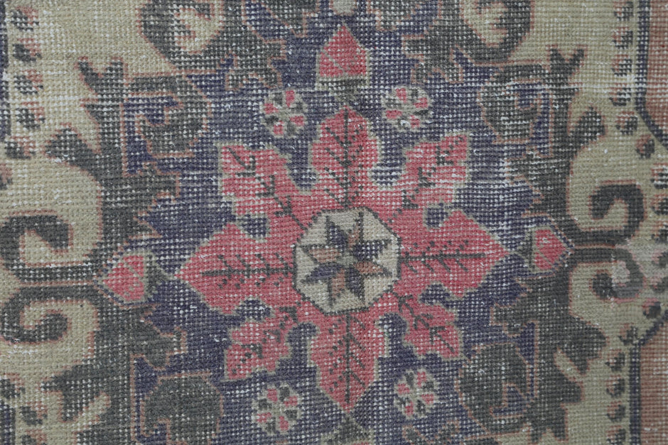 Vintage multicolor medallion rug displayed in eclectic living room