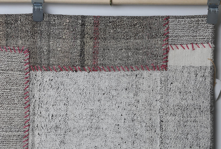Neutral toned patchwork texture detail on handmade wool cotton runner