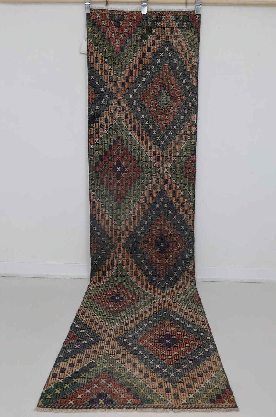 Close-up of diamond medallion motif on multicolor oriental kilim runner