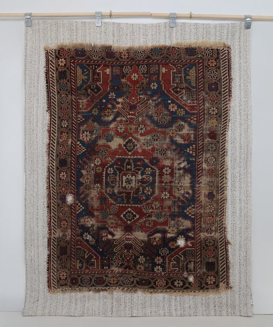 Layered tribal motif detail on antique wool cotton tapestry