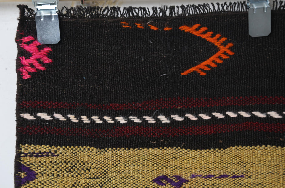 Wool flatweave texture close-up, tribal kilim runner
