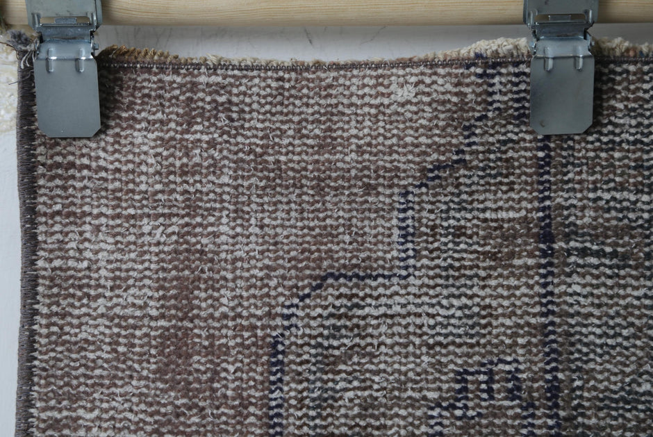 Minimal distressed pattern detail, alt angle, doormat rug