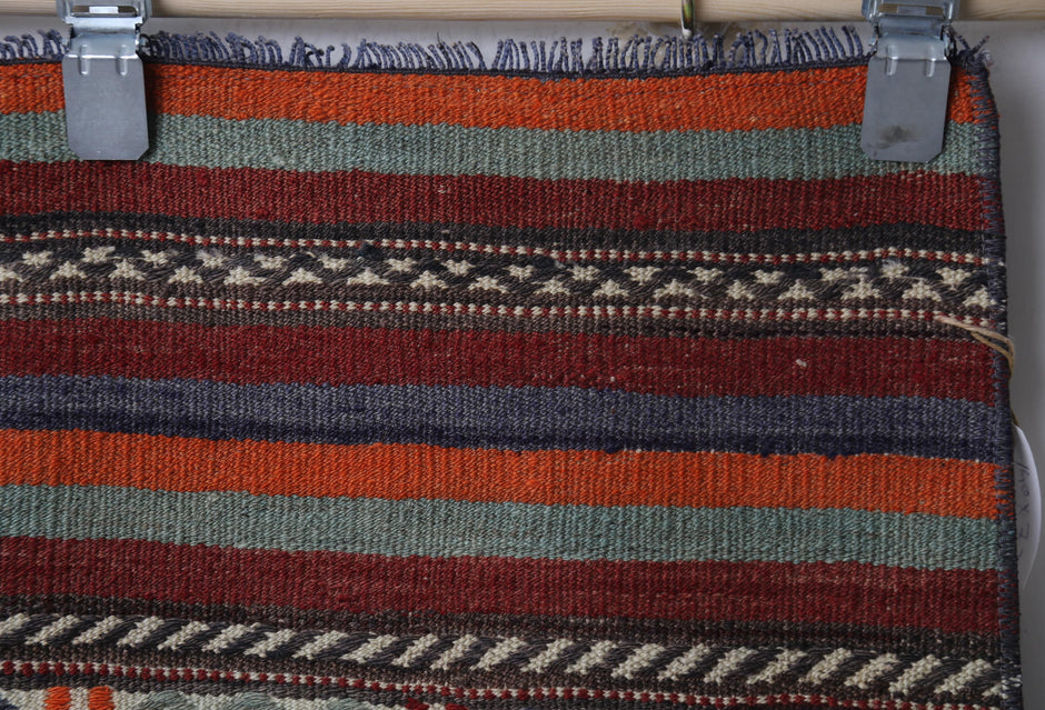 Side perspective, pattern arrangement, red brown kilim runner