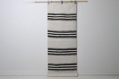 2'3 x 5'10 vintage Turkish hemp runner rug hanging showing white field with black horizontal stripes