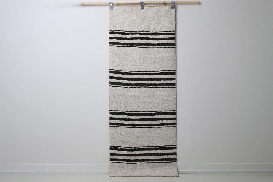 2'3 x 5'10 vintage Turkish hemp runner rug hanging showing white field with black horizontal stripes