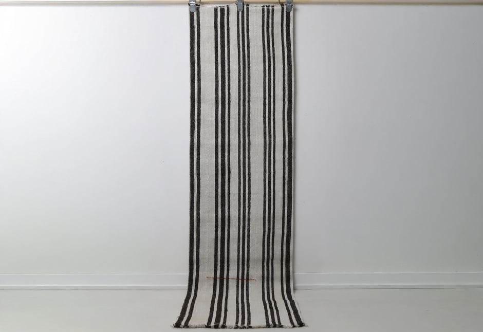 2'0 x 7'7 vintage Turkish hemp runner rug hanging showing white field with black vertical stripes