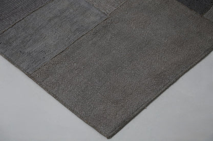 Full vintage hemp patchwork runner rug hanging showing long gray hallway rug panel design