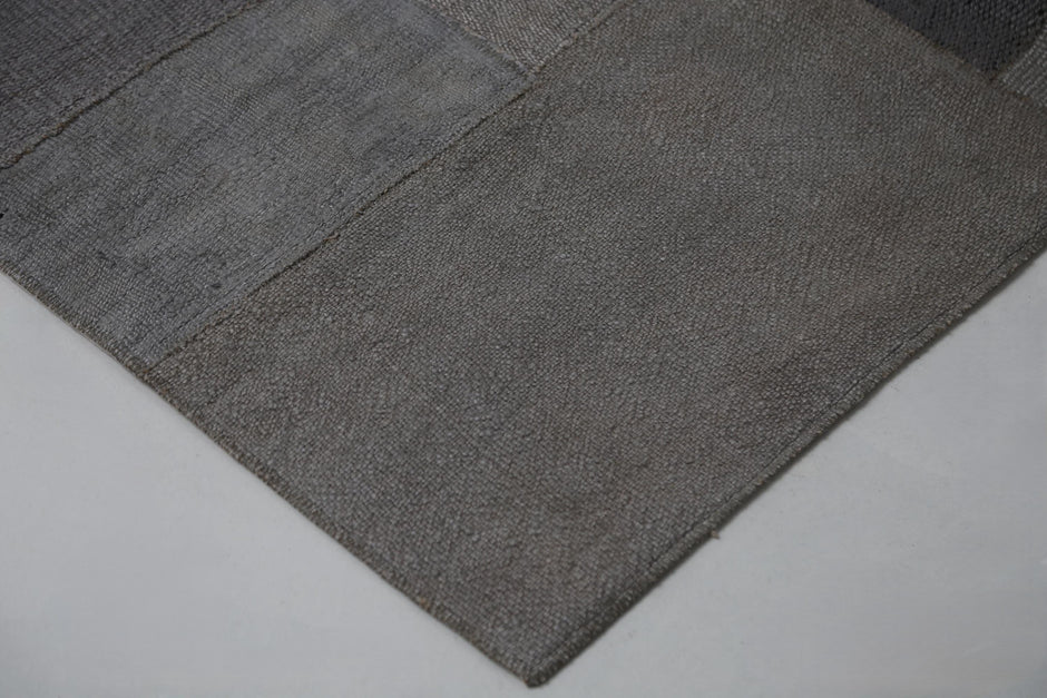 Full vintage hemp patchwork runner rug hanging showing long gray hallway rug panel design