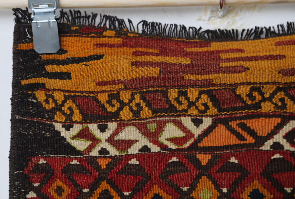 Geometric pattern composition, alt angle, tribal kilim rug
