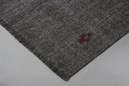Black white flatweave rug close-up, striped pattern weave texture