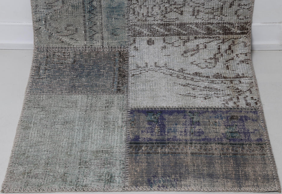 Full vintage patchwork runner rug hanging showing gray blue overdyed hallway rug design