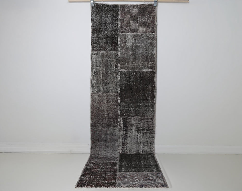 2x8 vintage patchwork runner rug hanging showing full gray brown panel design