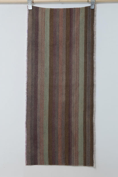 Close-up of vintage Turkish flatweave runner showing brown, purple and green vertical stripes