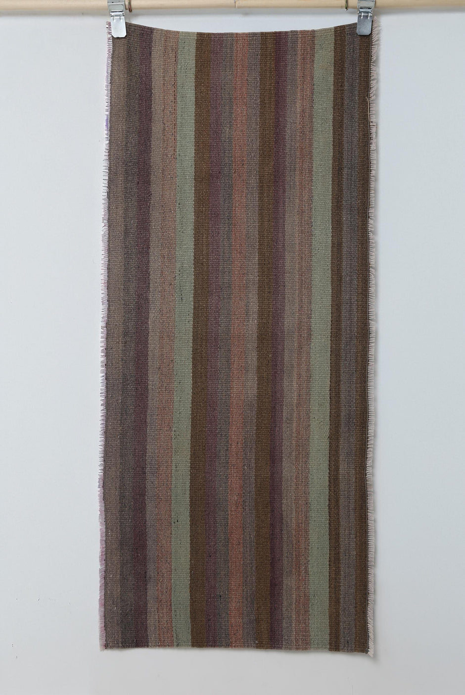 Close-up of vintage Turkish flatweave runner showing brown, purple and green vertical stripes
