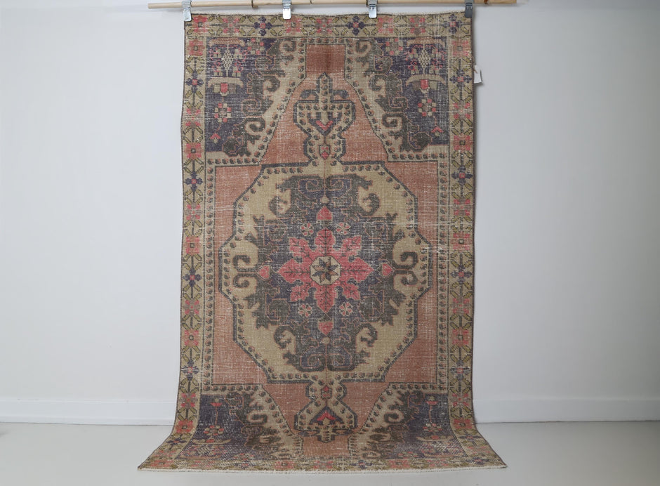 Close-up of floral medallion detail on multicolor Anatolian rug
