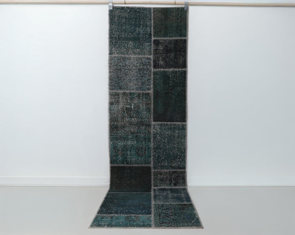 2x9 vintage patchwork runner rug hanging showing full deep green overdyed panel design