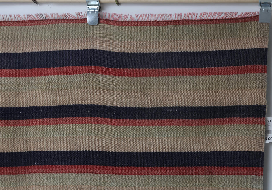 Back side of handmade multicolor wool kilim rug showing flatweave texture