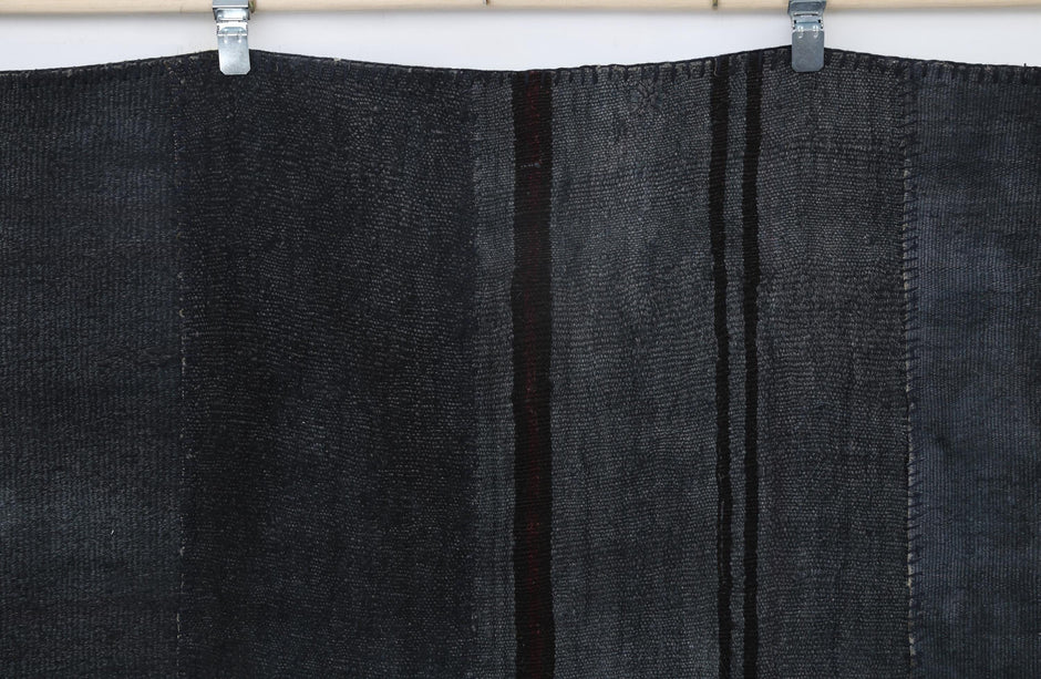 Faded hemp texture detail on handmade monochromatic area rug