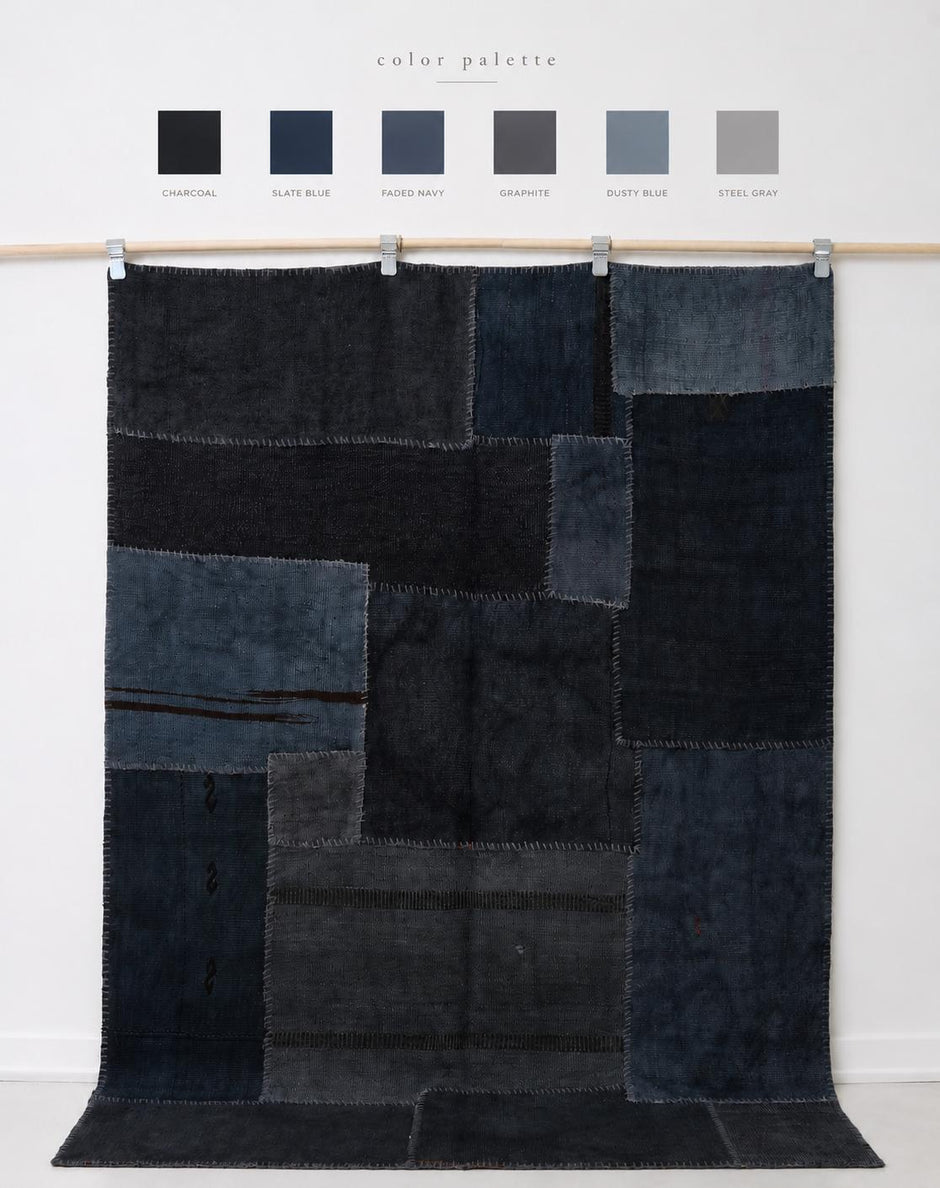Close-up of vintage Turkish hemp rug texture showing dark blue patchwork panel seams