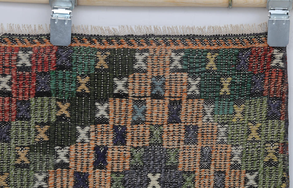 Vintage oriental kilim runner displayed in long hallway setting
