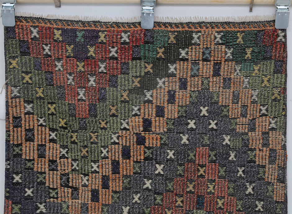 Back side of handmade multicolor wool cotton kilim runner showing weave texture