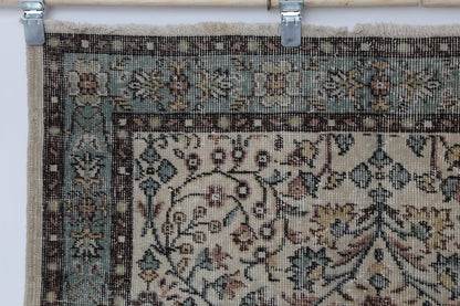 Side angle, full layout, beige green floral runner rug