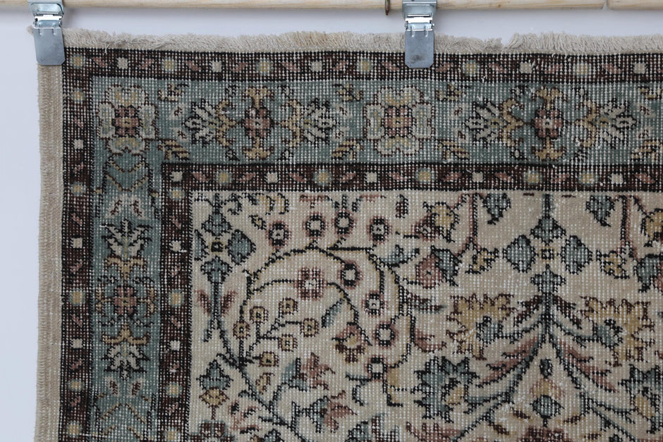 Side angle, full layout, beige green floral runner rug