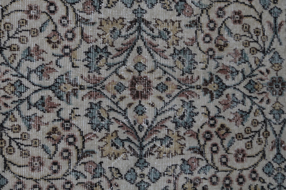 Handmade construction texture detail, distressed floral rug