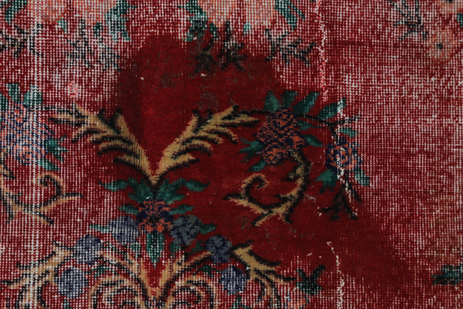 Back side of handmade red and beige wool cotton oriental rug showing weave texture