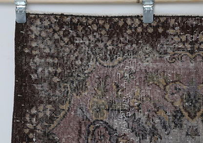  Back side of handmade gray pink and brown oriental rug showing weave texture