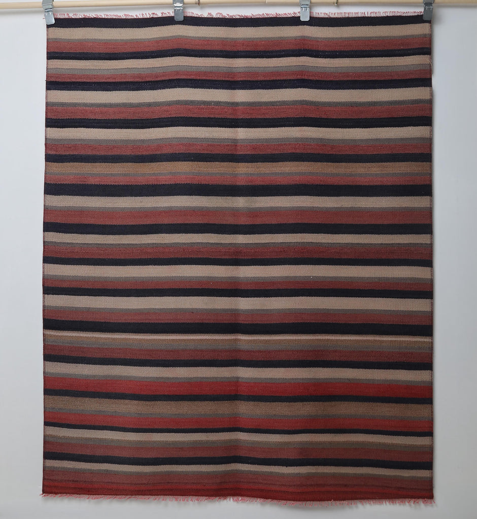 Wool flatweave texture detail on handmade tribal kilim