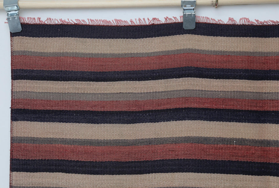 Vintage multicolor kilim rug displayed in bohemian living room