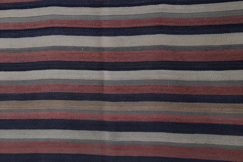 Back side of handmade multicolor wool kilim rug showing flatweave texture