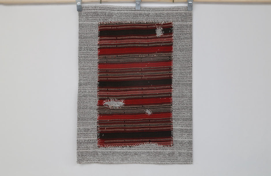 Woven stripe texture detail on handmade wool wall hanging