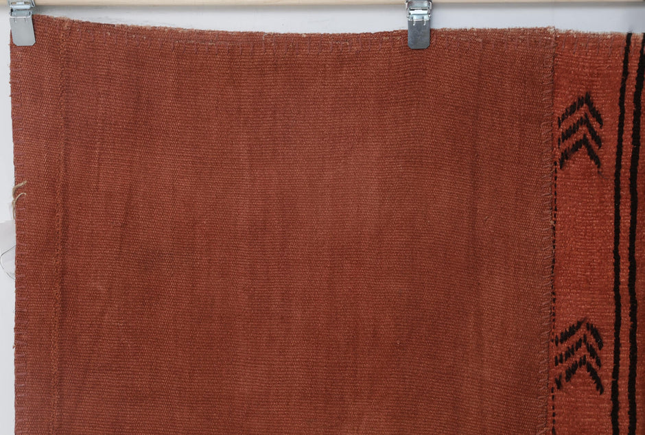 Close-up of stitched panel detail on orange hemp patchwork rug