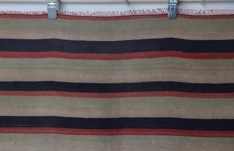 Vintage multicolor kilim rug displayed in bohemian living room