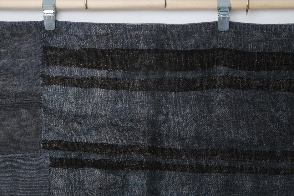 Aged organic hemp texture detail on handmade flatwoven rug