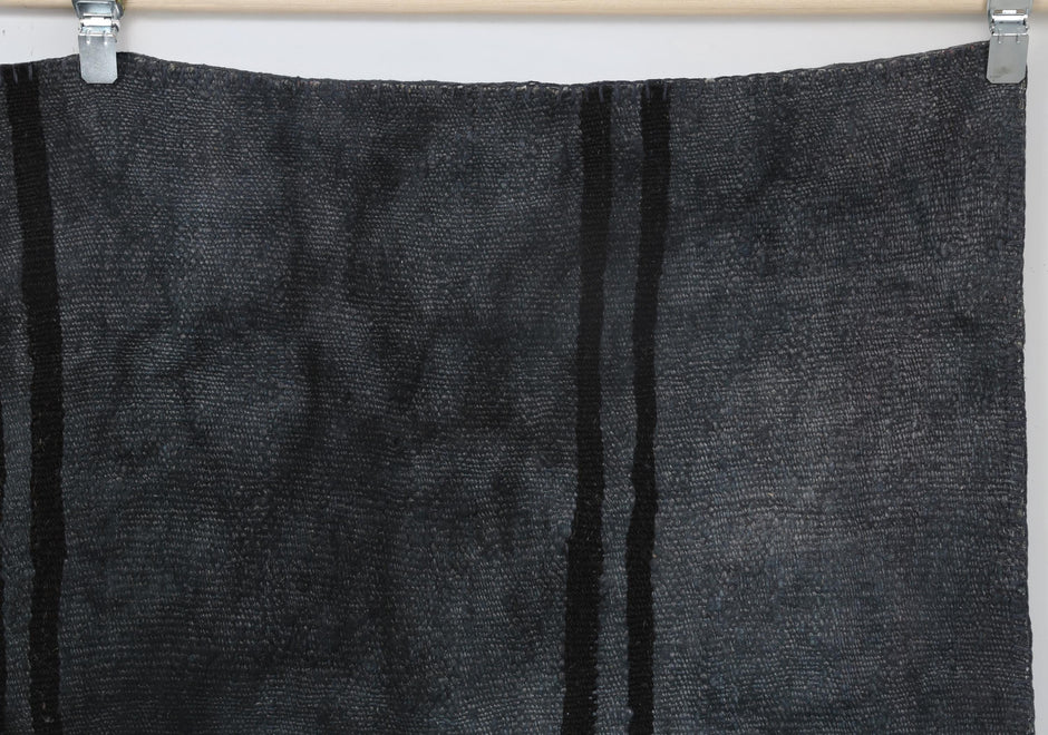 Layered geometric texture detail on handmade oversized hemp rug