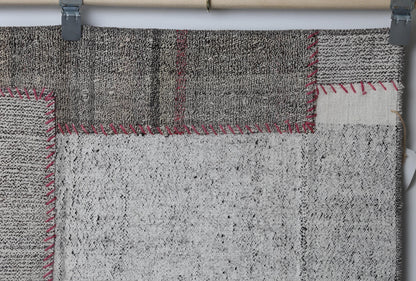 Neutral toned patchwork texture detail on handmade wool cotton runner