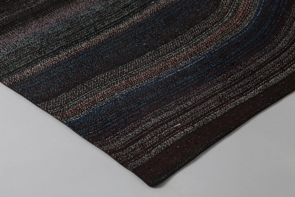 Back side of handmade dark multicolor wool cotton kilim rug showing weave texture