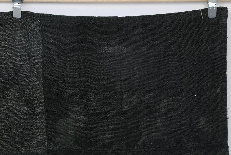 Natural hemp texture detail on handmade monochromatic area rug