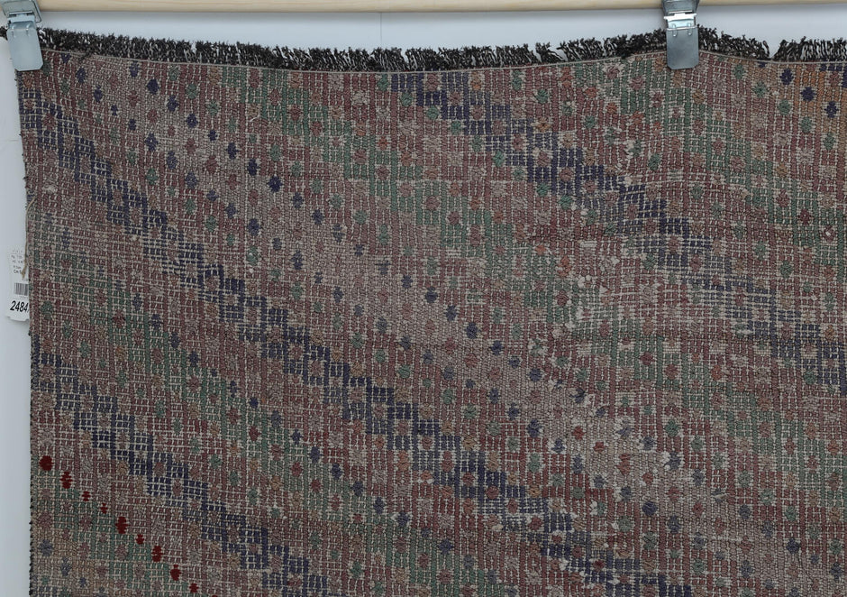 Close-up of diamond motif detail on multicolor oriental kilim rug