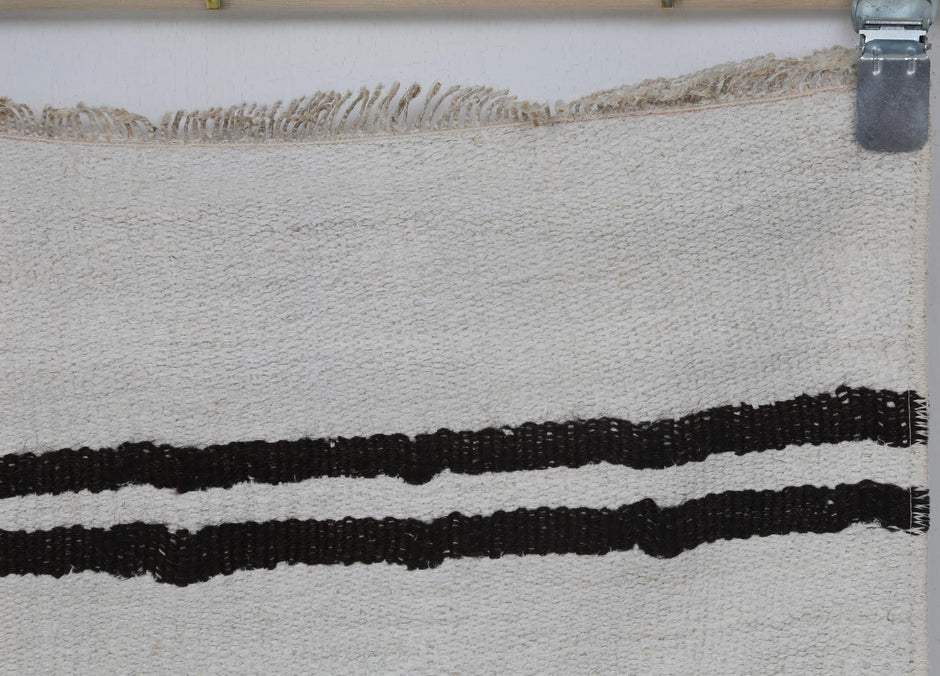 Vintage hemp runner rug displayed in hallway entryway setting