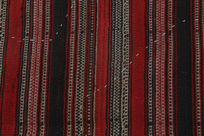 Back side of handmade red and multicolor wool tapestry rug showing weave texture