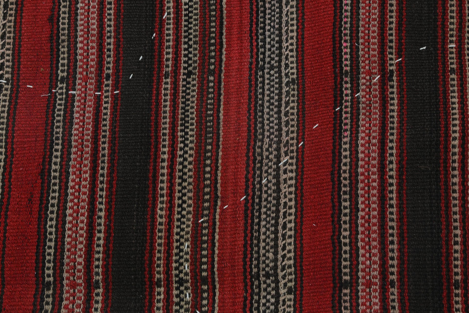  Back side of handmade red and multicolor wool tapestry rug showing weave texture