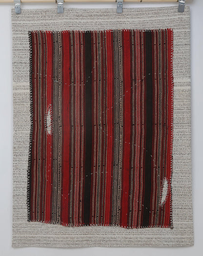 Vertical stripe texture detail on handmade wool tribal wall hanging