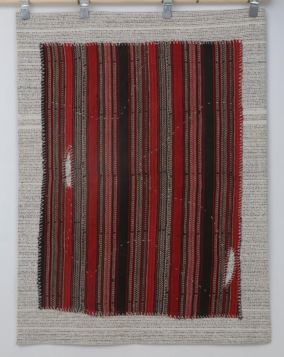 Vertical stripe texture detail on handmade wool tribal wall hanging